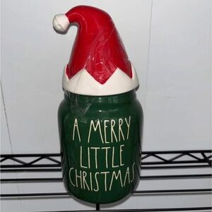 Rae Dunn Green Christmas canister with Red Santa Hat